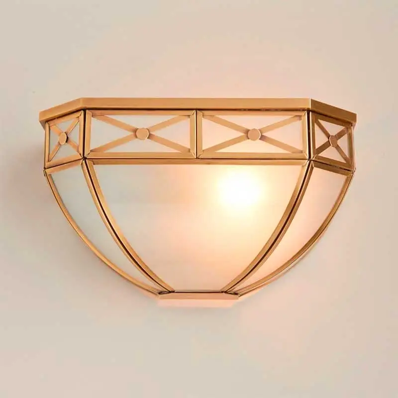 Antique wall light in brass