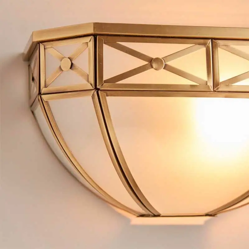 Antique wall light in brass