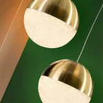 Orb pendant light in satin brass finish