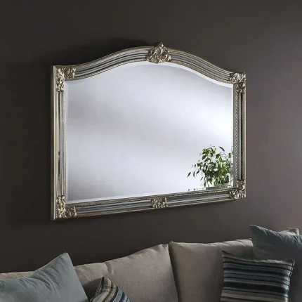 Arched overmantle mirror in silver frame