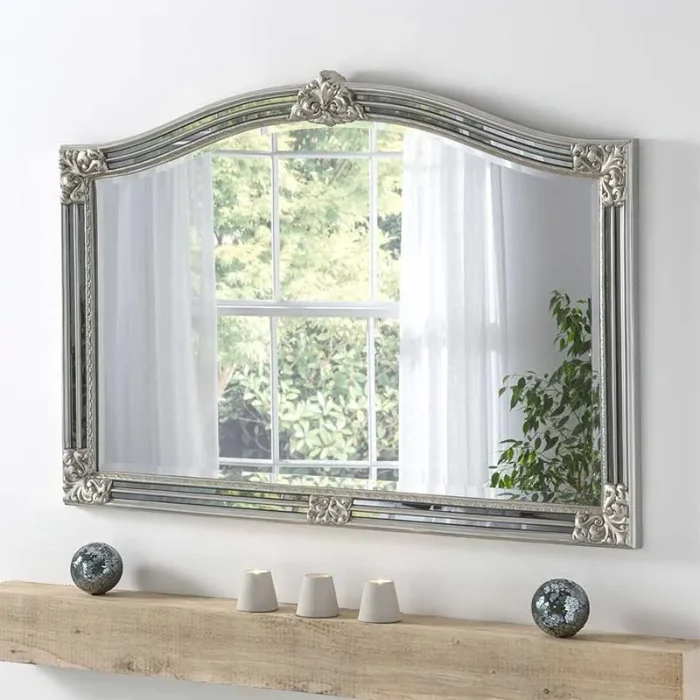 Arched overmantle mirror in silver frame