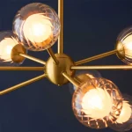 Satin brass pendant light with clear glass shades and inner frosted glass diffusers
