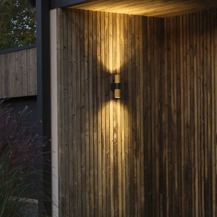 Black & gold up & down outdoor wall light for patio, entrance and garden areas