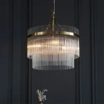 3 light pendant light in antique brass finish with clear glass