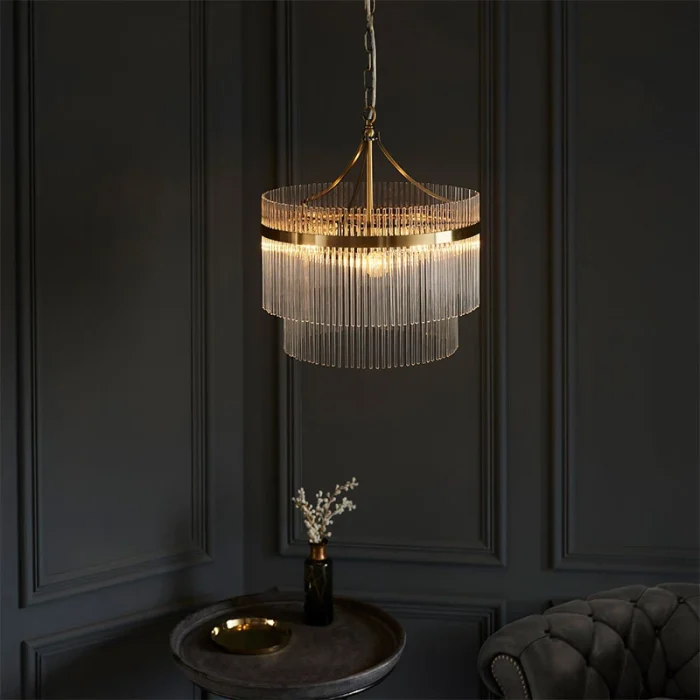 3 light pendant light in antique brass finish with clear glass