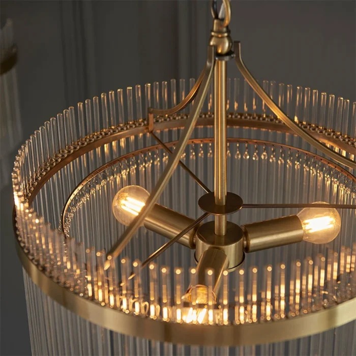 3 light pendant light in antique brass finish with clear glass