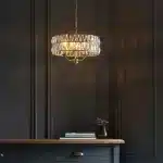 3 light pendant light in antique brass finish with clear glass