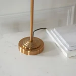 Table lamp in aged brass finish with natural linen fabric shade