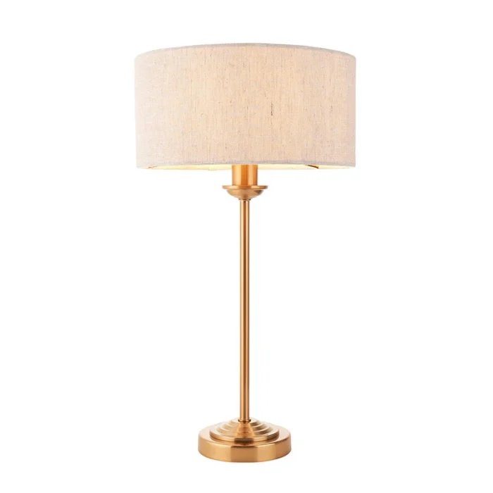 Table lamp in aged brass finish with natural linen fabric shade