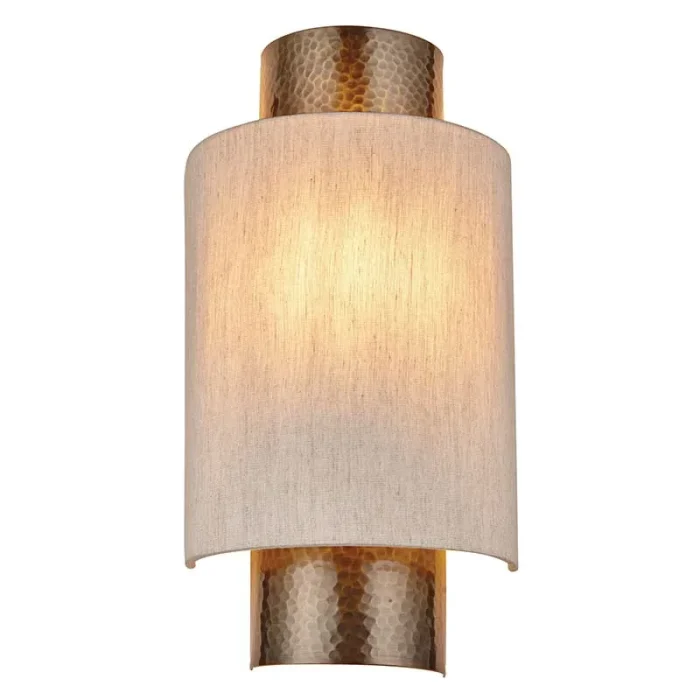 Wall light in aged bronze finish with natural fabric shade