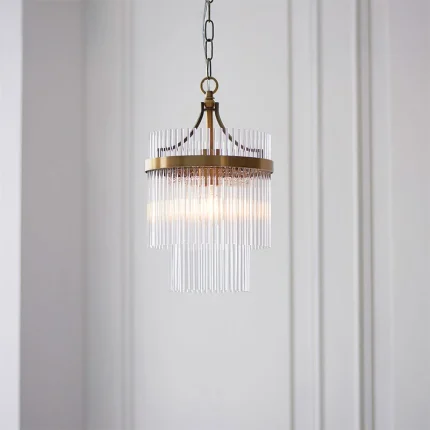 Pendant light in antique brass finish with clear glass rods