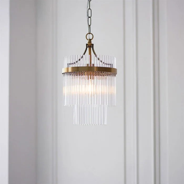 Pendant light in antique brass finish with clear glass rods