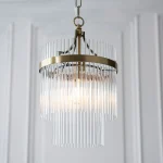 Pendant light in antique brass finish with clear glass rods