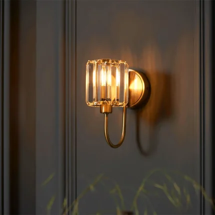 Wall light in antique brass plated finish