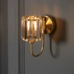 Wall light in antique brass plated finish