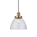 Single pendant light in antique brass finish with clear glass shade