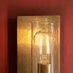 Brass hammered wall light clear glass shade