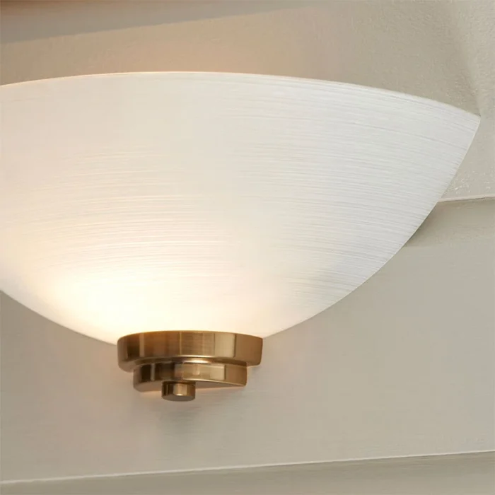 Wall light in brushed brass finish