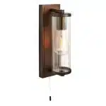 Bathroom wall light in dark bronze finish with clear glass shade