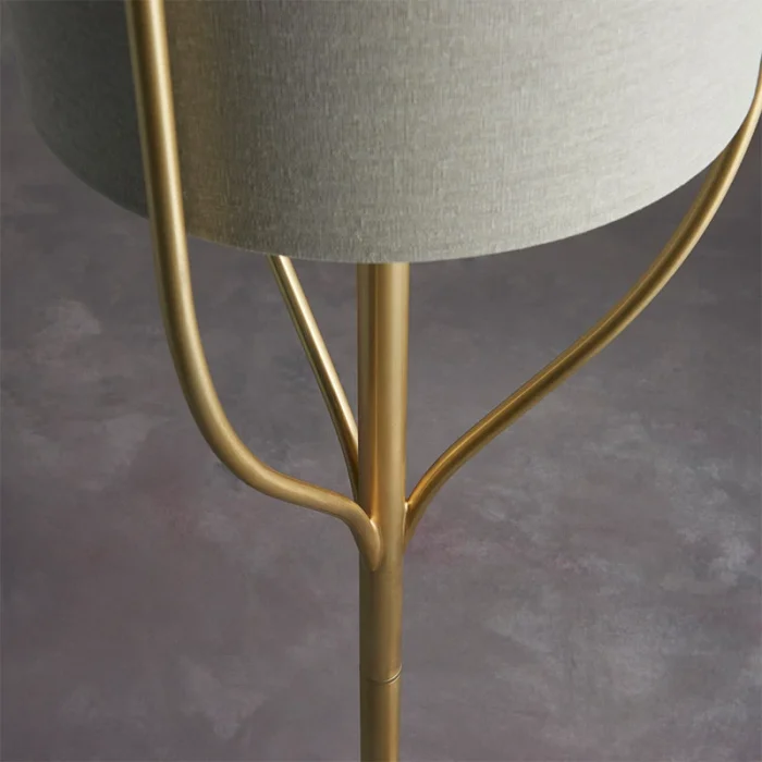 Floor lamp in satin brass finish with natural fabric shade