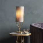 Table lamp in satin brass finish with natural linen fabric shade