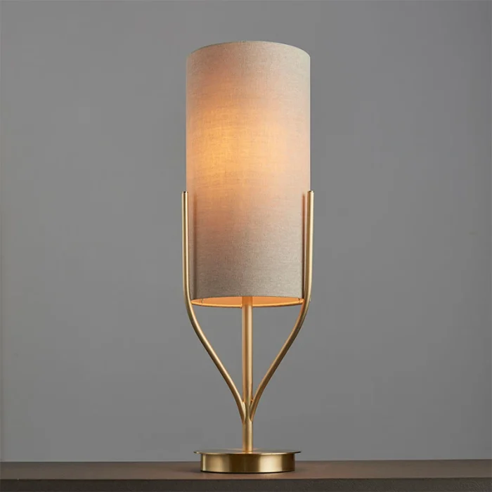 Table lamp in satin brass finish with natural linen fabric shade