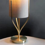 Table lamp in satin brass finish with natural linen fabric shade