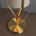 Table lamp in satin brass finish with natural linen fabric shade