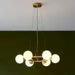 Rind design pendant light in satin brushed gold finish with gloss white glass shades